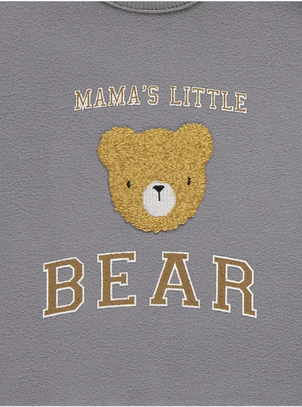 Set me bluzë me arush, jelek dhe pantallona të rifluara