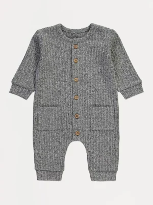 Njëcopëshe gri me mëngë të gjata, e thurur dhe me fund të kopsitur