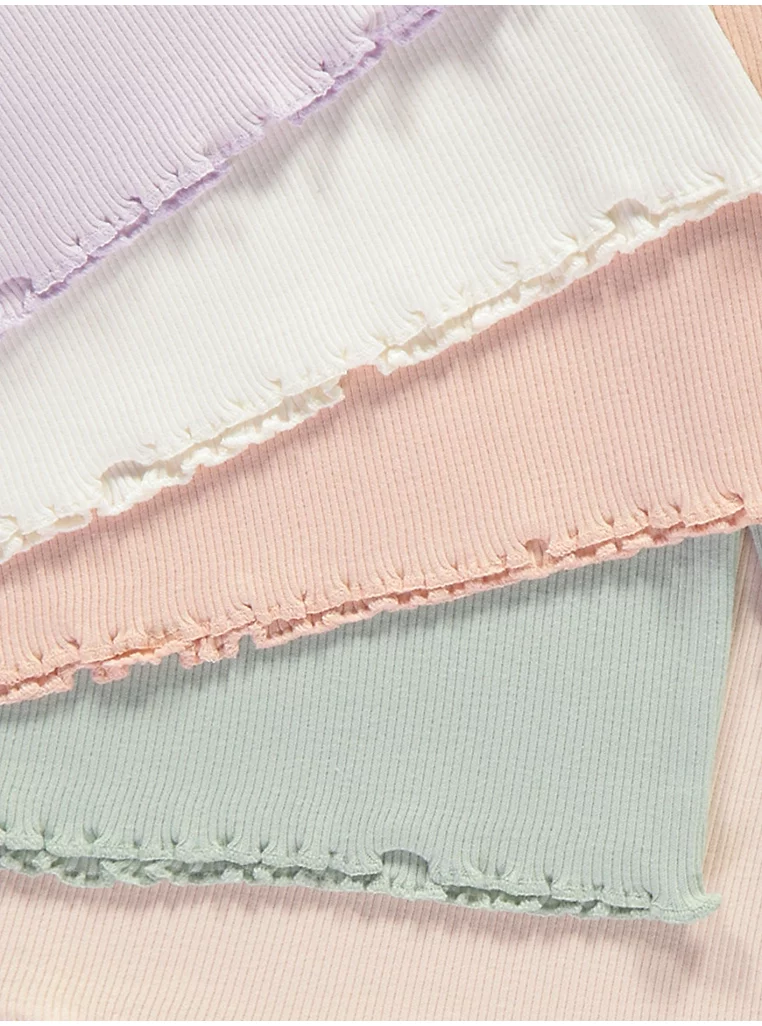 Set me 5 triko në ngjyra pastel me material ribbed dhe fund valëzuar