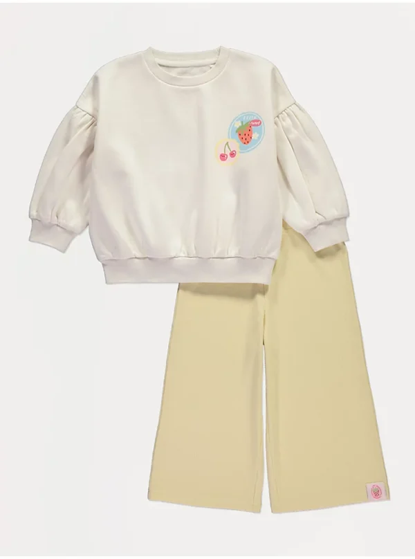 “Set me bluzë dhe pantallona me dizajn stampë frutash.”